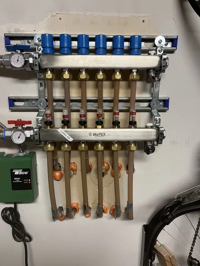 Plumber performing Water Heater Repair at a residential property in Walton